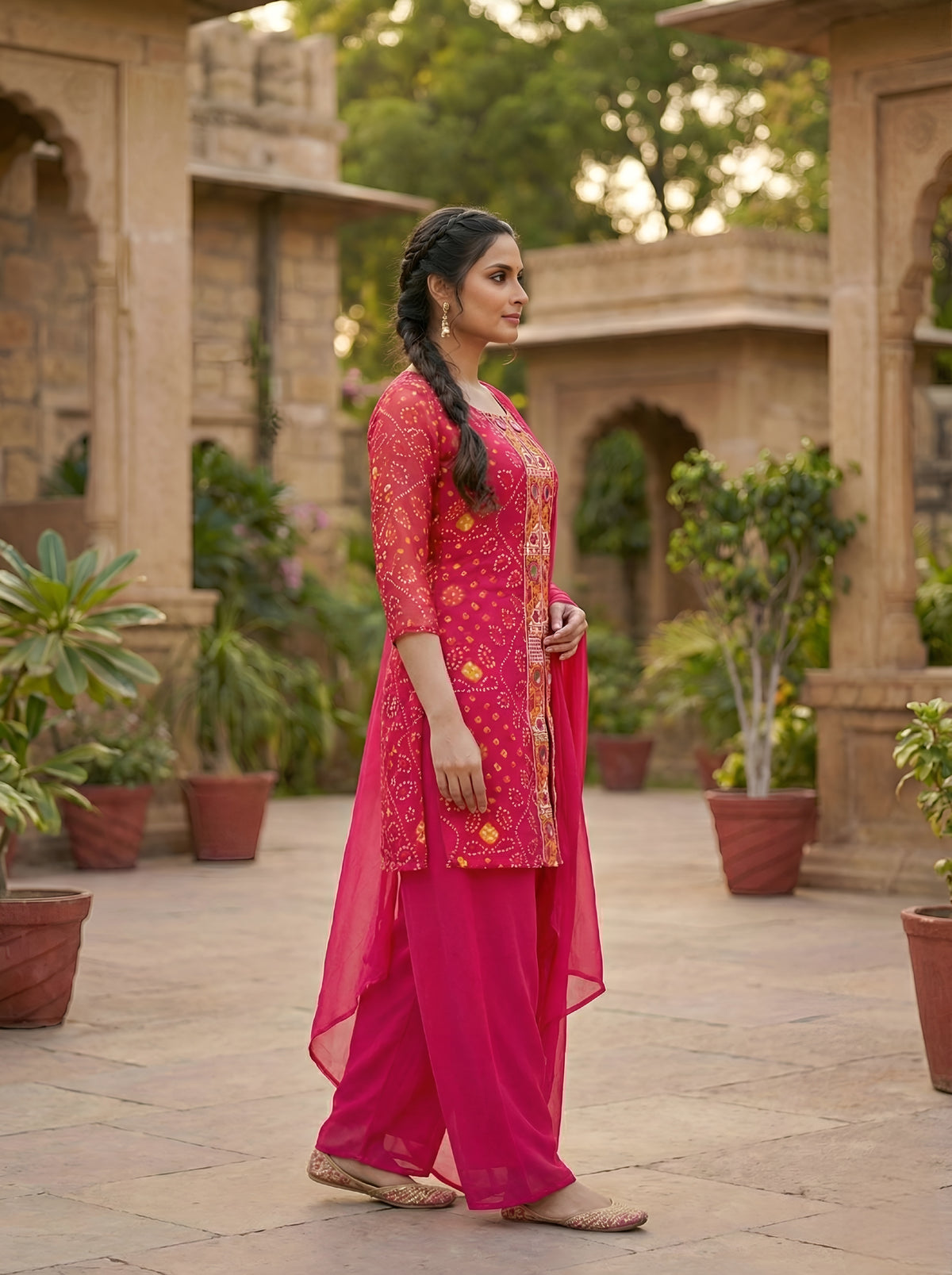 A Rich Purple And Pink Bandhani Printed Plazo set Featuring An Embroidered Front Panel, Flowy Matching Bottoms and A Sheer Dupatta For An Elegant Ethnic Look. (NFRD01)