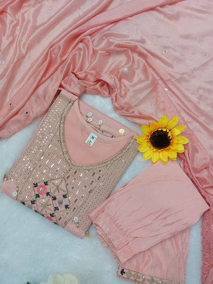 Featuring beautifully Crafted Pure Roman Silk Suits in beautiful Colours, which are decorated with finest sequence & Cowry Embroidery Work (RRRD02)