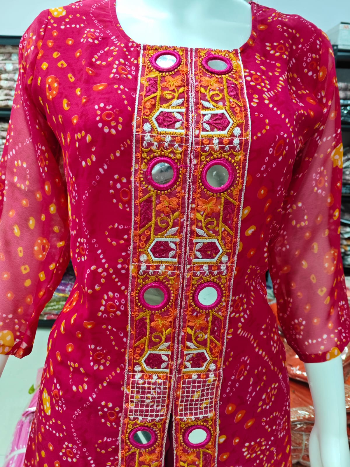 A Rich Purple And Pink Bandhani Printed Plazo set Featuring An Embroidered Front Panel, Flowy Matching Bottoms and A Sheer Dupatta For An Elegant Ethnic Look. (NFRD01)