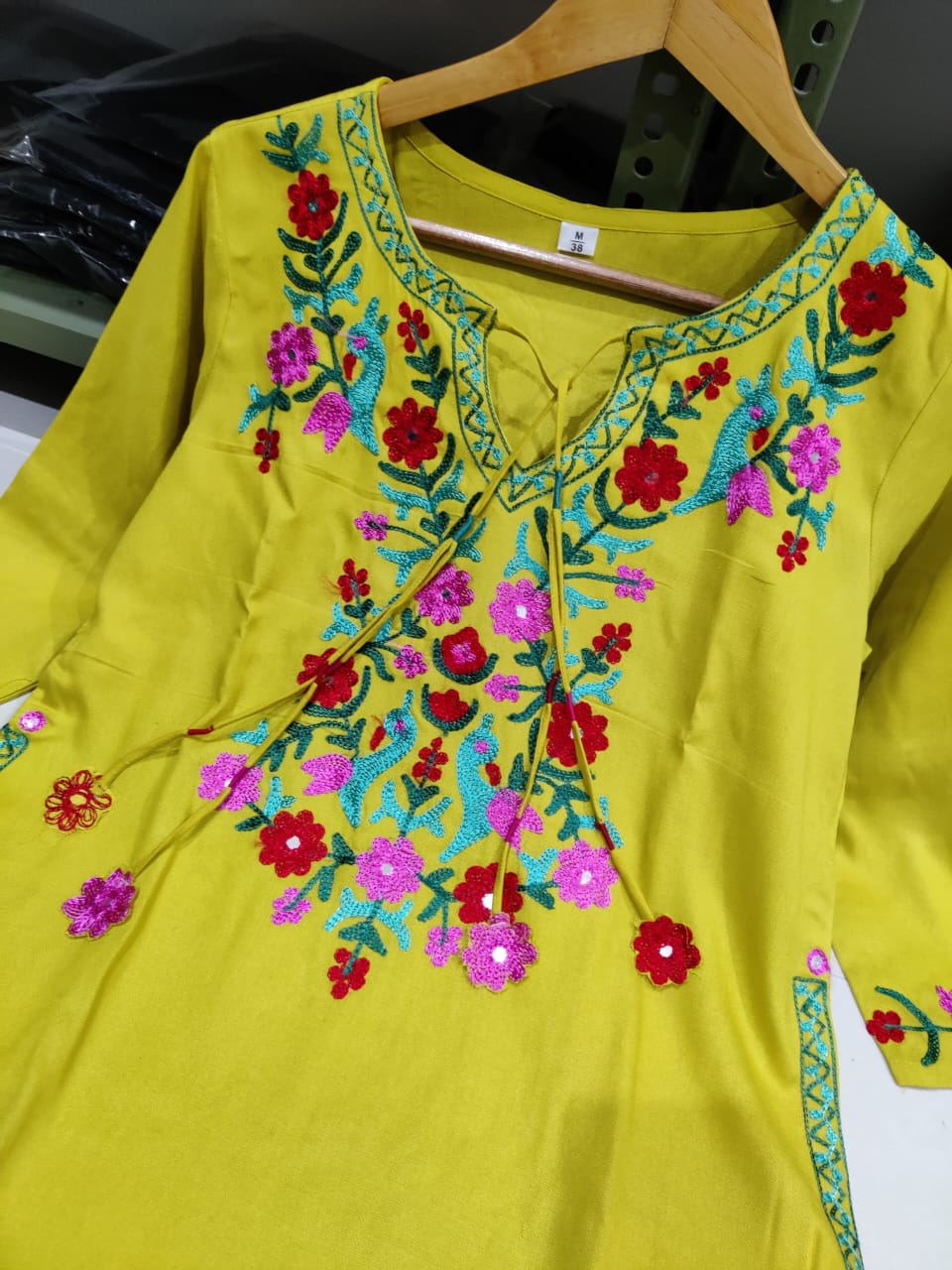 Get your hands on our beautiful off-white kurti with intricate thread aari work detailing in bright tone perfect for any auspicious occasion. (SWSK27)