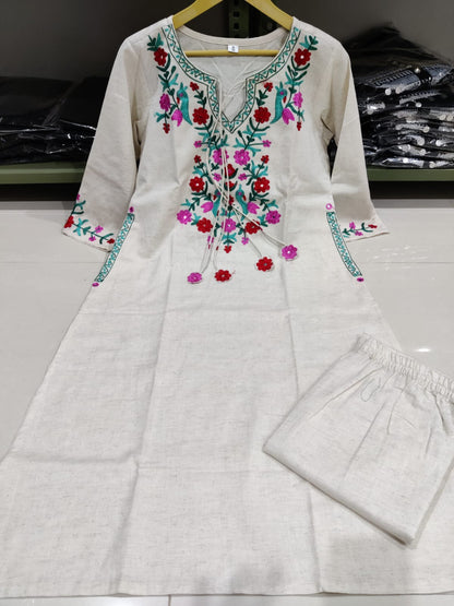 Get your hands on our beautiful off-white kurti with intricate thread aari work detailing in bright tone perfect for any auspicious occasion. (SWSK27)
