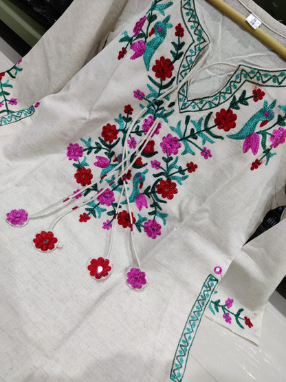 Get your hands on our beautiful off-white kurti with intricate thread aari work detailing in bright tone perfect for any auspicious occasion. (SWSK27)