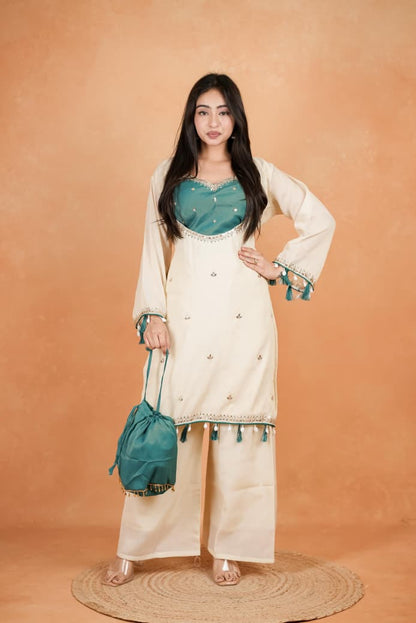 Featuring beautiful Heavy Suit Set which is beautifully decorated Embroidered🪡and Hand work. It is paired with matching Plazzo🪡.Complet Lining with Beautiful work(RRRD39)